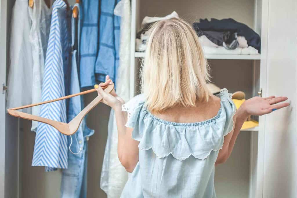 woman organising wardrobe